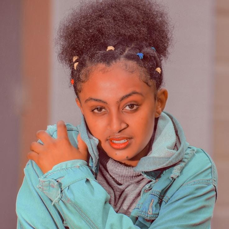 Ava Singh, Lead Design Curator at MintHarvestField, reviewing corporate floral arrangements